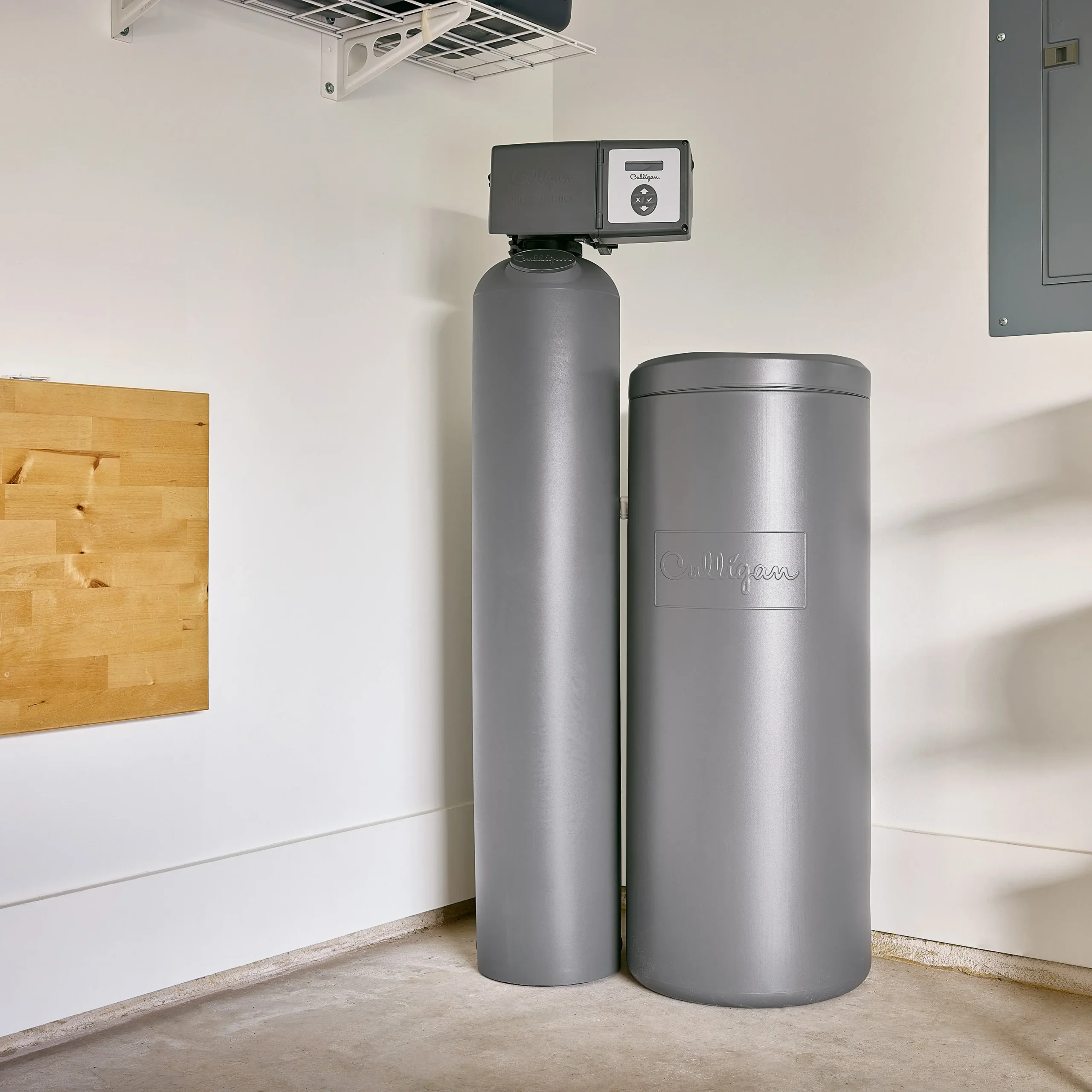 Water treatment specialist testing filtered water quality at whole-home system